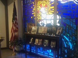 stained glass window with photo display at the 2021 Turkey Fundraiser