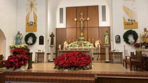 altar decorated with poinsettias